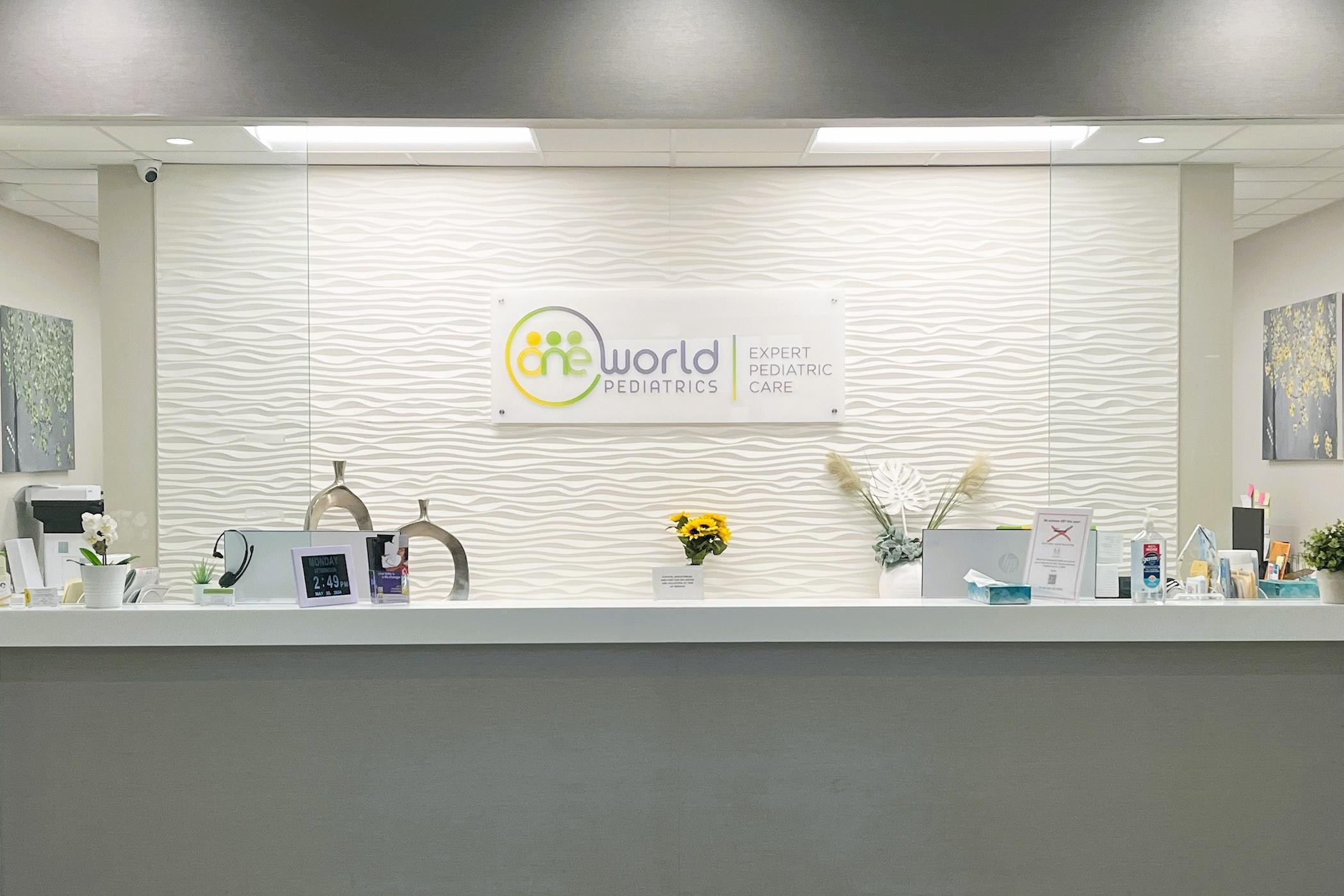 A provider with a young patient and parent