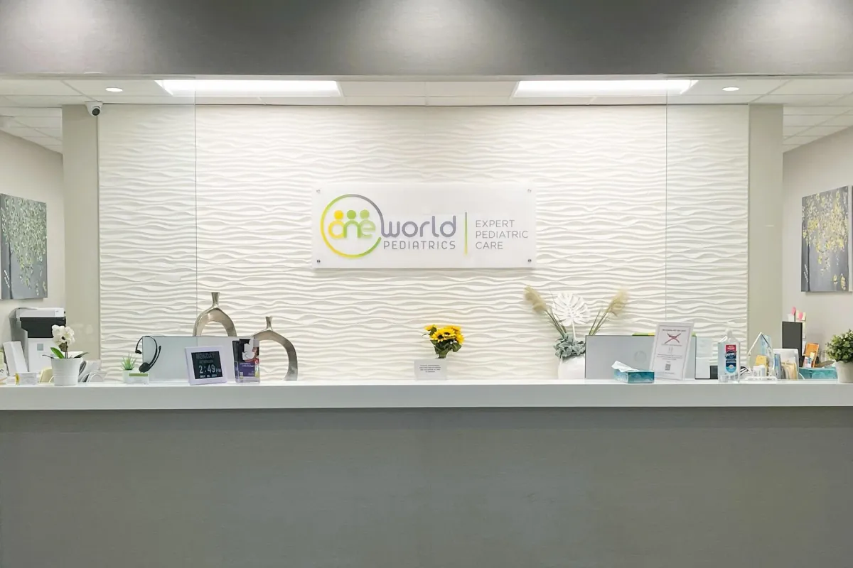 A provider with a young patient and parent